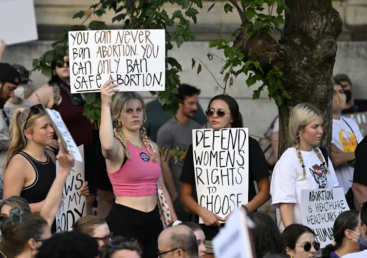 Young women protest restrictions on access to abortion.
