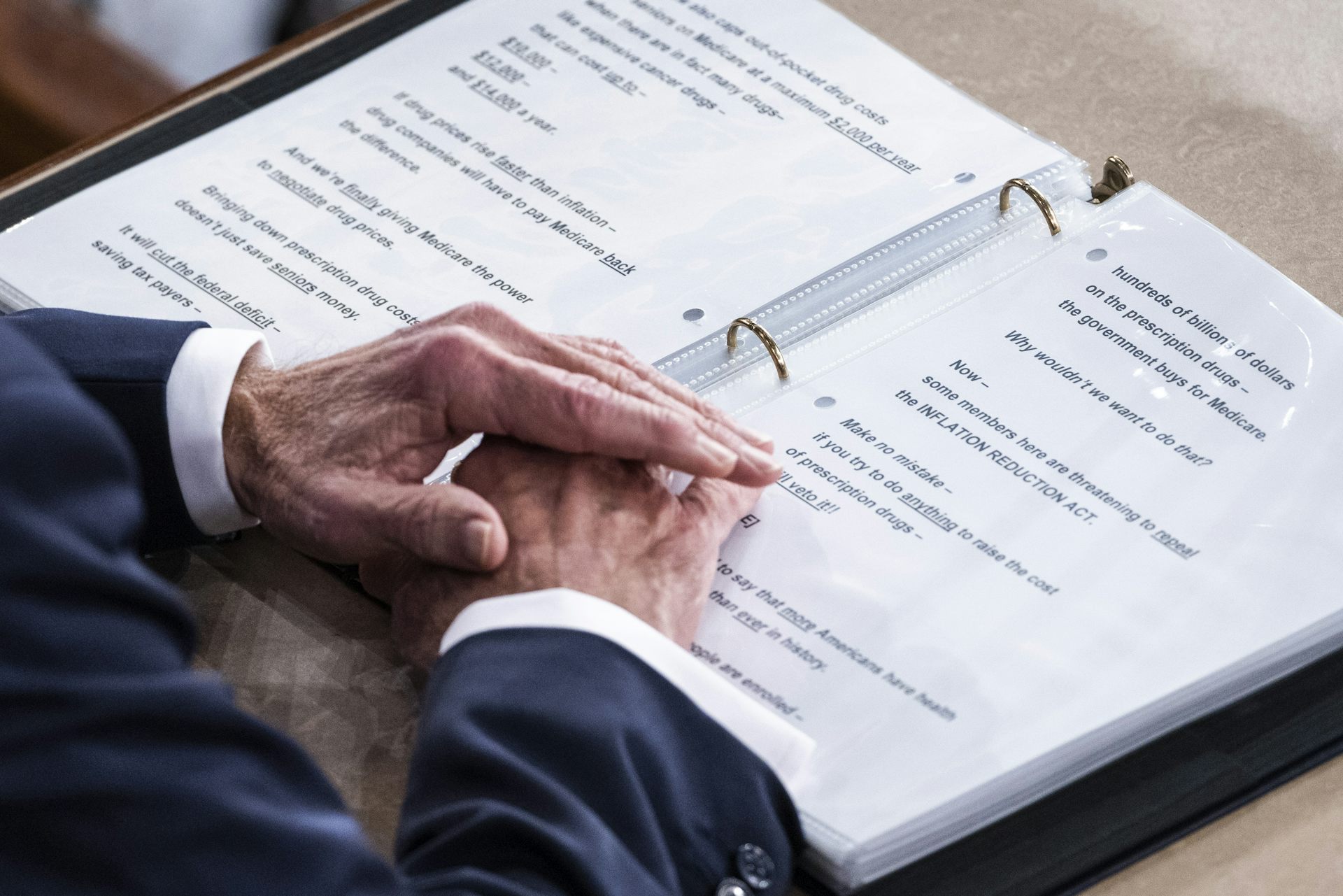 Joe Biden's hands on a folder containing his State of the Union speech.