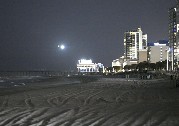 View of Myrtle Beach at night, a lighted balloon flies in the sky