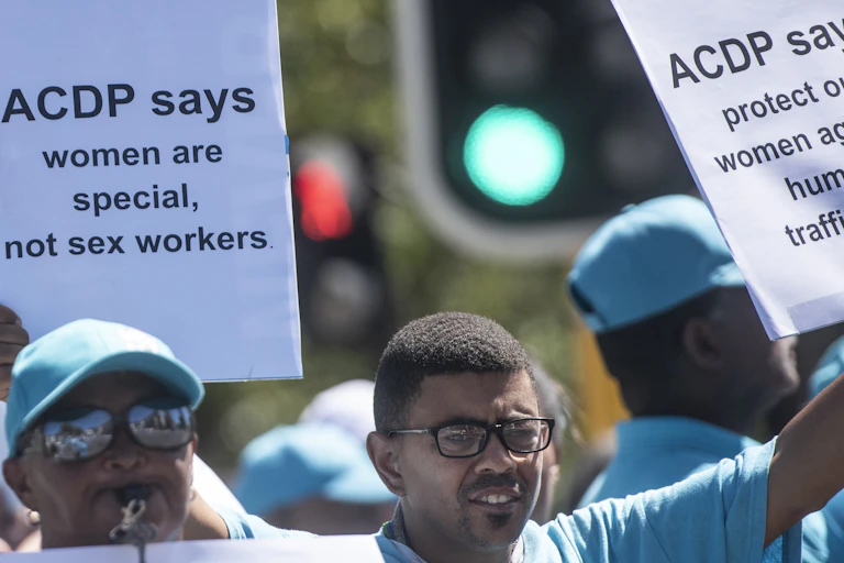 anti-sex work protestors holding placards