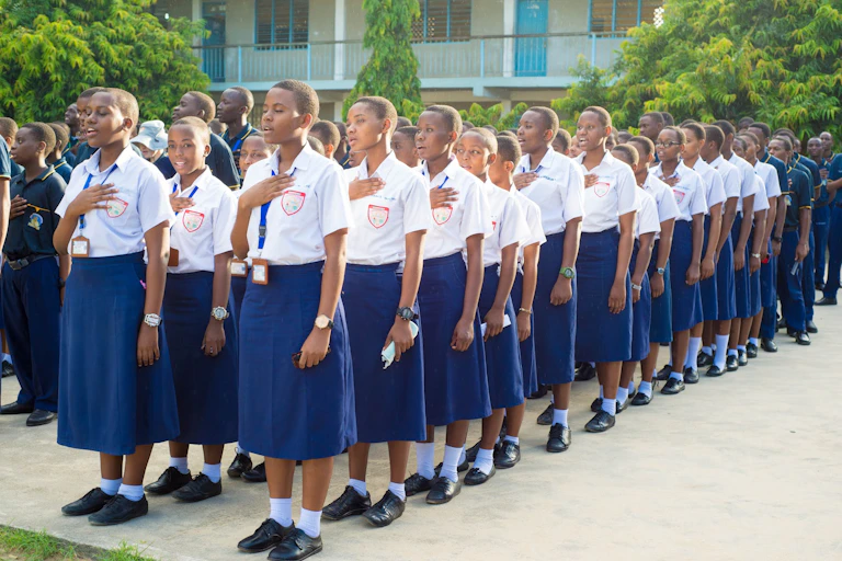 A group of boys and girls on a school assembly line