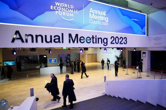 People gather in the lobby of a conference centre