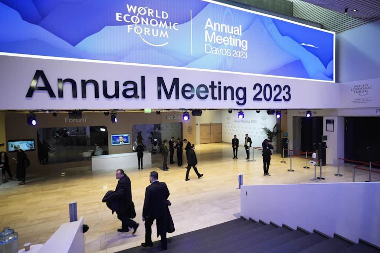 People gather in the lobby of a conference centre