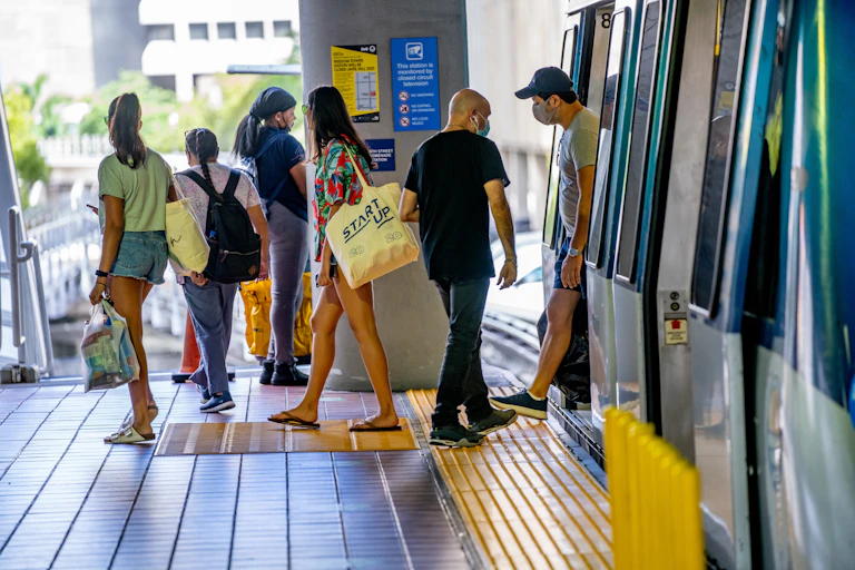 People getting on and off a train
