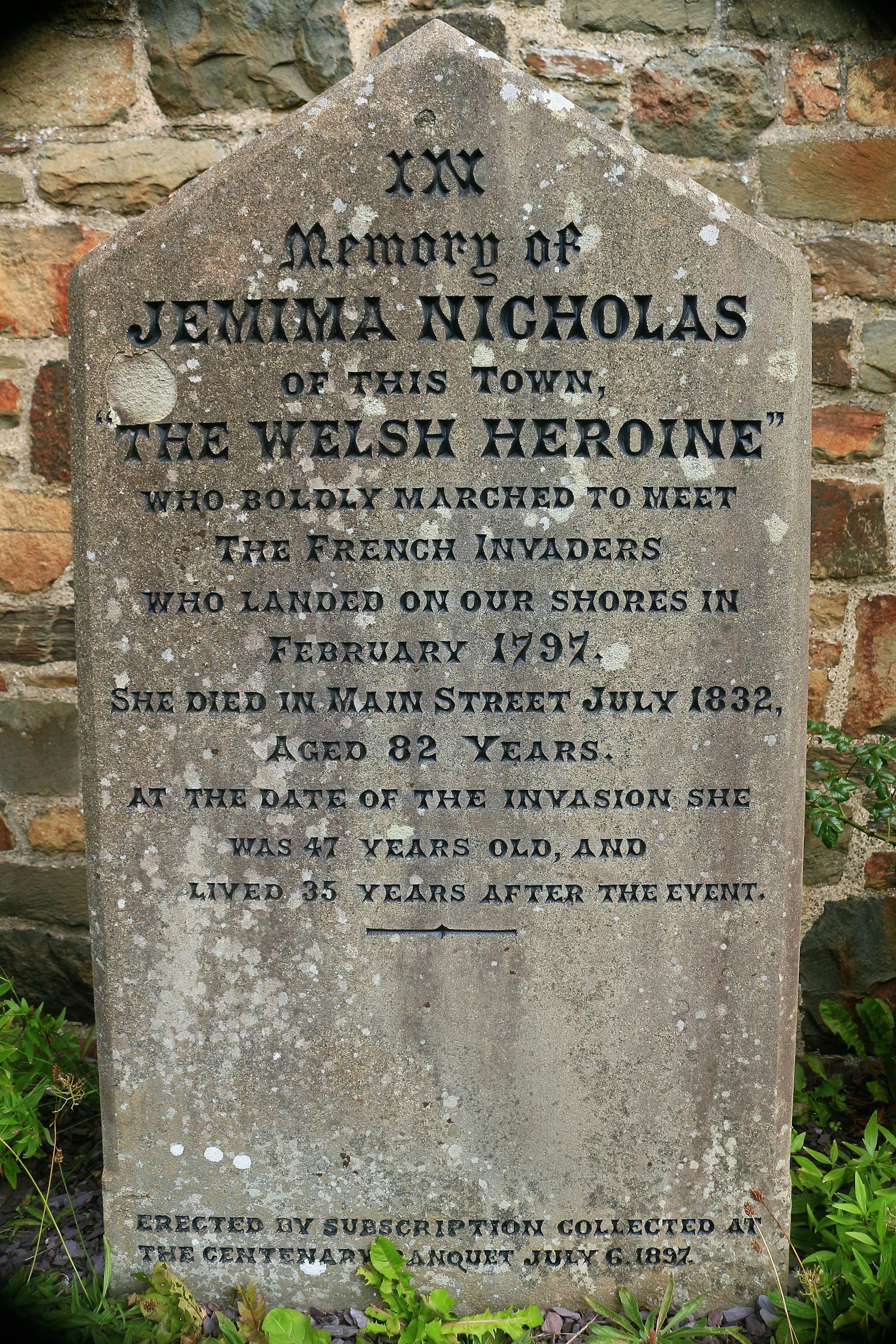 An old memorial stone with the words 