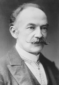 A portrait of Thomas Hardy with a twiddly moustache.