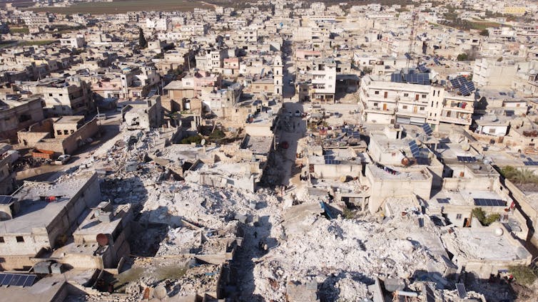 an aerial photo showing a devastated urban area