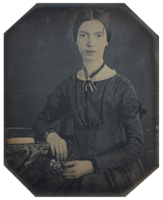 Black white photograph of Emily Dickinson, she wears her hair parted in the middle and a long sleeved black dress.