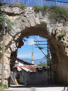 A Roman-era ruin that shows a stone arch overlooking Antakya.