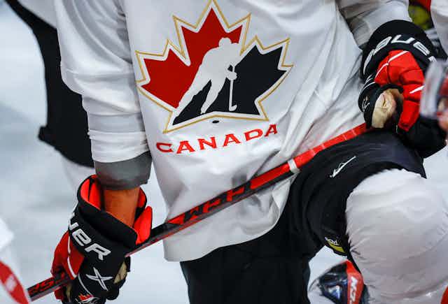 A Hockey Canada logo is shown on the jersey of a player.