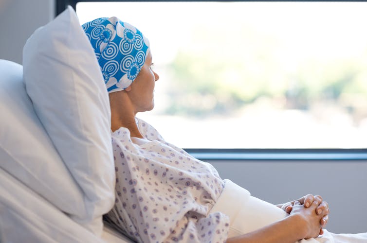 A cancer patient looks out the window.