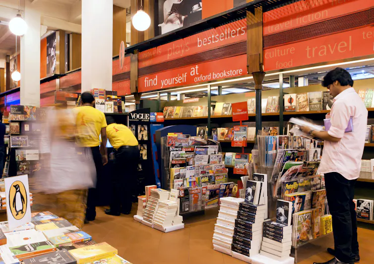 Customers read books at India's Kolkata Book Fair.