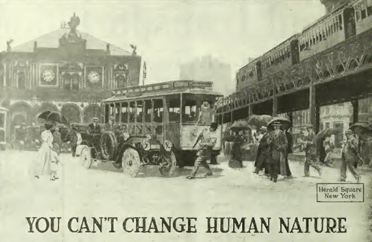An advertisement of a man absentmindedly walking in front of a street car.