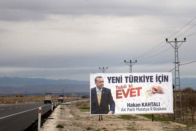 Billboard next to highway featuring Turkish politician.