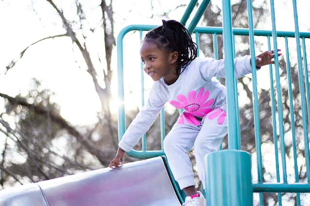 Young girl playing on a playground