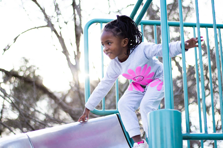 Young girl playing on a playground