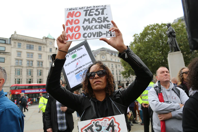 anti-vaccine protesters stage a demonstration in Trafalgar Square