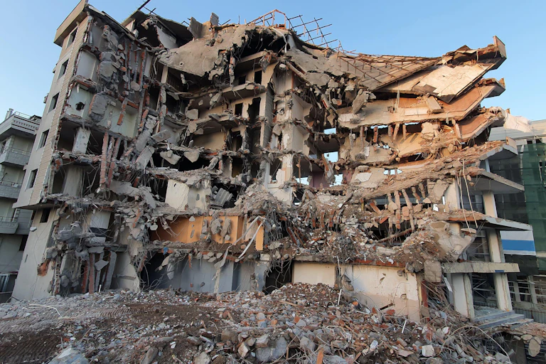 A building showing massive earthquake damage.
