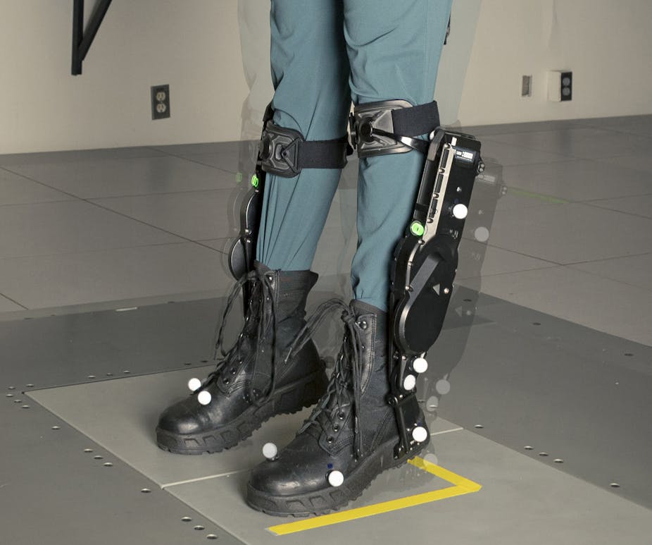 a pair of lower legs wearing a mechanical device
