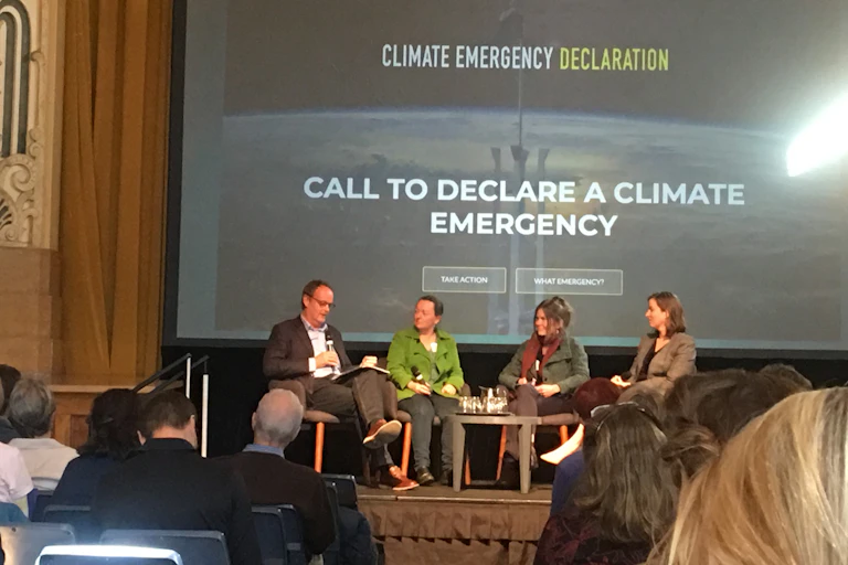 Community members attend a council meeting to discuss declaring a climate emergency