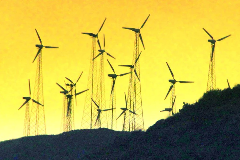 Windmills stand on a hill