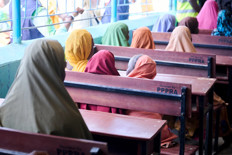 Schoolgirls sit in Camp Bulumkutu, Nigeria