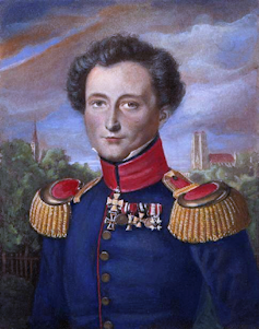 A portrait of a man with dark hair in a military uniform.