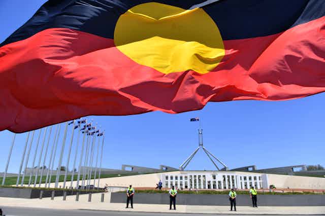 Aboriginal flag in front of the Parliament of Australia, Canberra