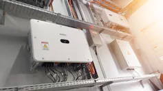 A small white box with wires coming out of it
