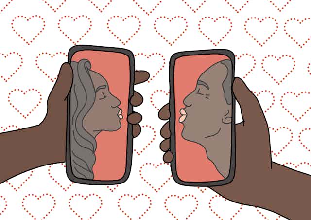 An illustration showing two cellphones being held by two hands. A male and a female African figure is seen in profile on either screen. They are making a kissing shape with their lips, against a backdrop of heart illustrations.