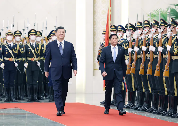 Philippines president Ferdinand Marcos Jnr inspects an honour guard accompanied by Chinese president Xi Jinping