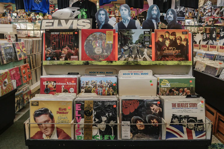 Record store racks full of Elvis, Beach Boys and The Beatles vinyl records