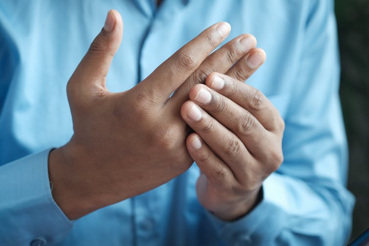 Man's hands with arthritis