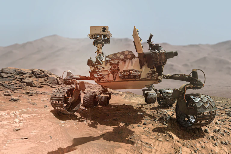 Photographic rendering of the Mars Curiosity rover in a red-dirt landscape.