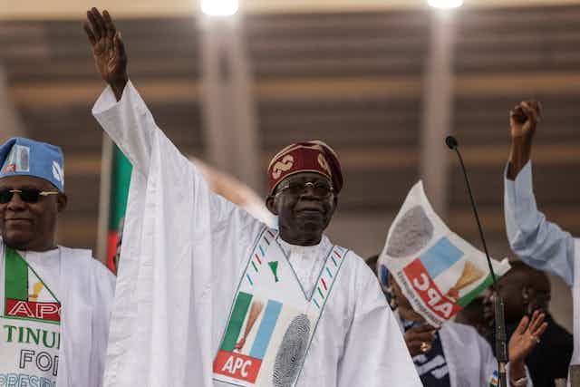 All Progressive Congress (APC) leader Bola Tinubu (C) gestures towards the crowd during the APC party campaign rally 