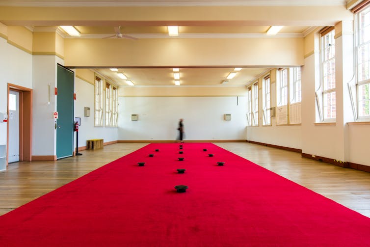 A red carpet in a empty hall