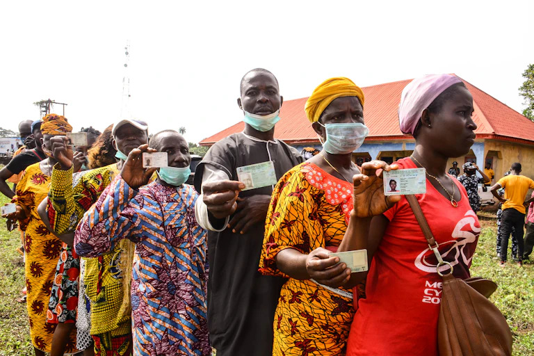 Residents queue to cast their vote during the Edo State governorship election in Benin