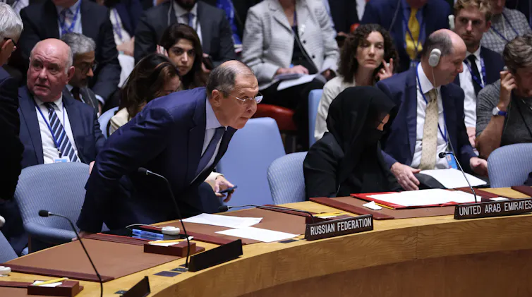 Russian Foreign Minister Sergey Lavrov take his seat at the UN security council.