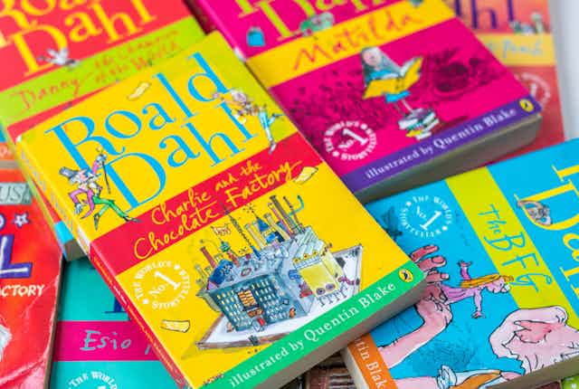 A pile of colourful Roald Dahl books.