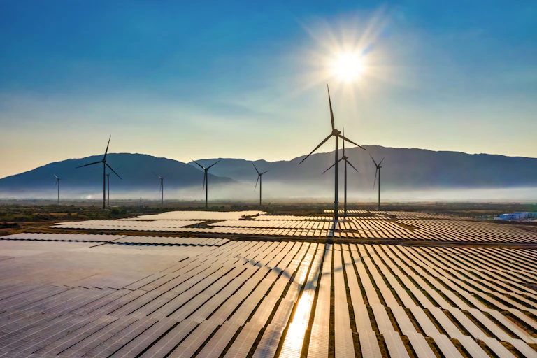 illustration of a solar farm with windmills in the background