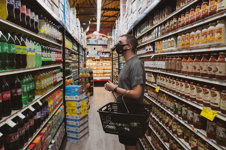 Man looks at soft drinks