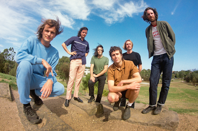 King Gizzard and the Lizard Wizard posing for a press shot