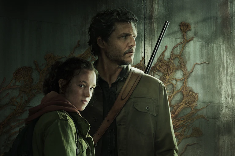 A girl and a man with a rifle stand in front of a cement wall with tendrils growing on it