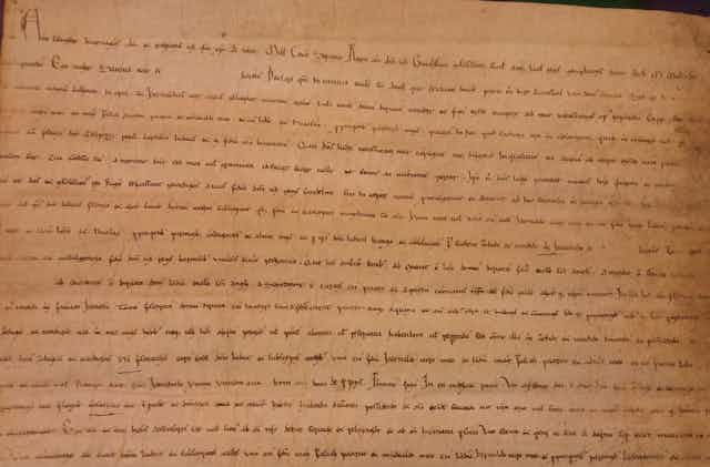 Documento escrito con caligrafía antigua en latín.