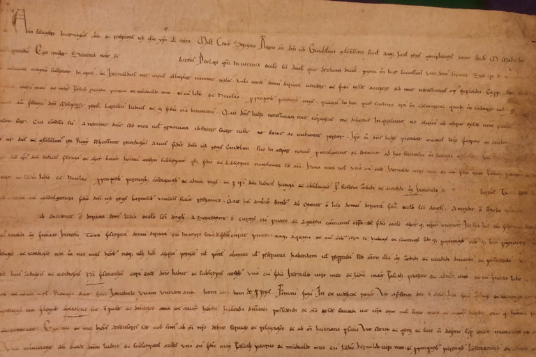 Documento escrito con caligrafía antigua en latín.
