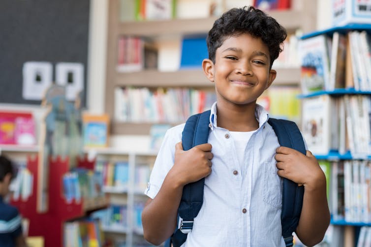 Boy smiling in classroom