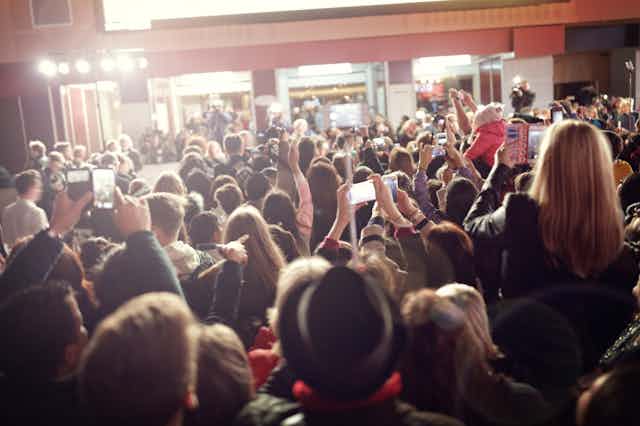 Crowd taking pictures