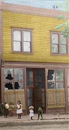 colourized yellow storefront from 1907