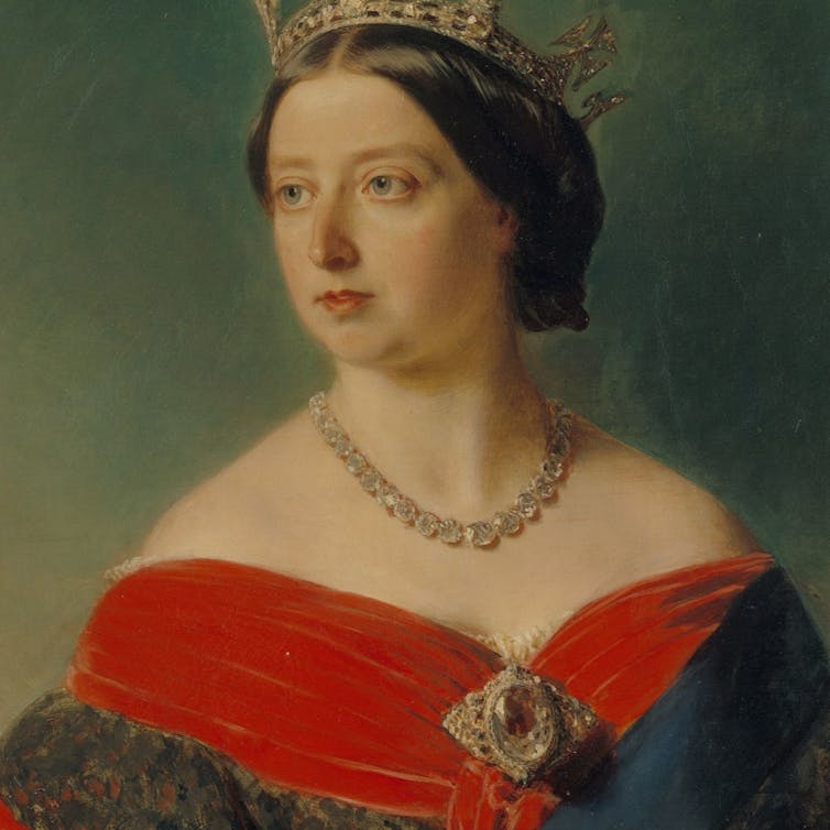 A historical painting of a queen in a red dress with a crown, a necklace and a large brooch.