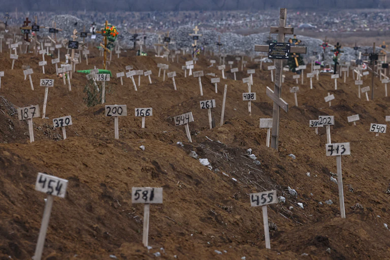 Graves of unidentified bodies outside Mariupol.